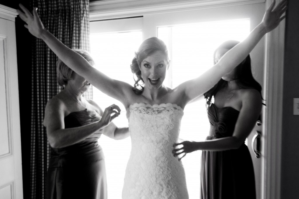 Leigh couldn't have too many hands helping her get dressed.  Mom wasn't too far away.   Photo courtesy of Rebecca Barger Photography