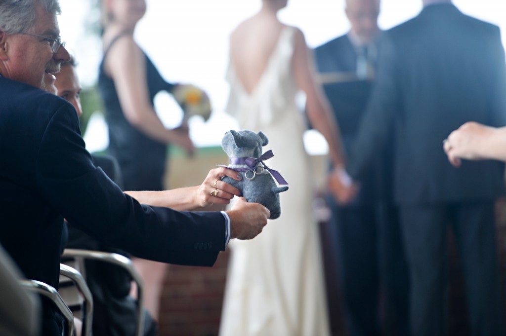 Johanna and Matt put lots of personal touches into their ceremony including tying their wedding bands to a stuffed dog and passing the dog around to all their guests during the ceremony so that each guest could touch the rings and send them love and support through their touch.