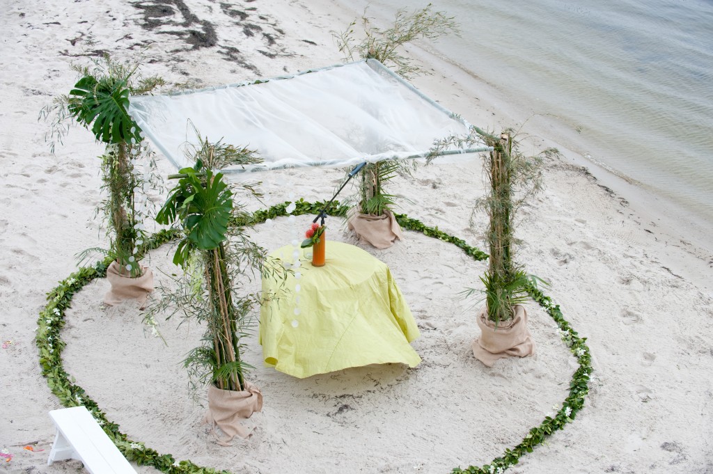 Jen and Paulo were supposed to be married on a Loveladies beach.  The weather prior to the ceremony did not permit the set-up.  The ceremony was moved to the beach next to the venue that was on the bay.  Kudos to Katydid Floral Design for setting it up in the rain.  The rain stopped long enough for the ceremony to be held outdoors and for the bride and groom to get some photos on the beach.  Photo courtesy of Jeff Tisman Photography