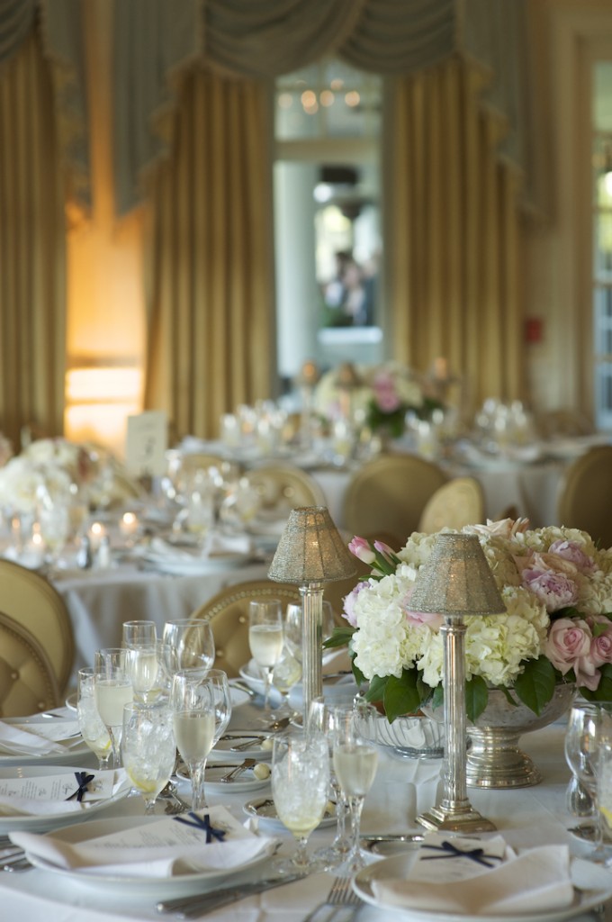 Alison and Bill used fluffy white hydrangea in silver bowls accented with light pink.  Photo courtesy of Therese Marie Wagner Photography.